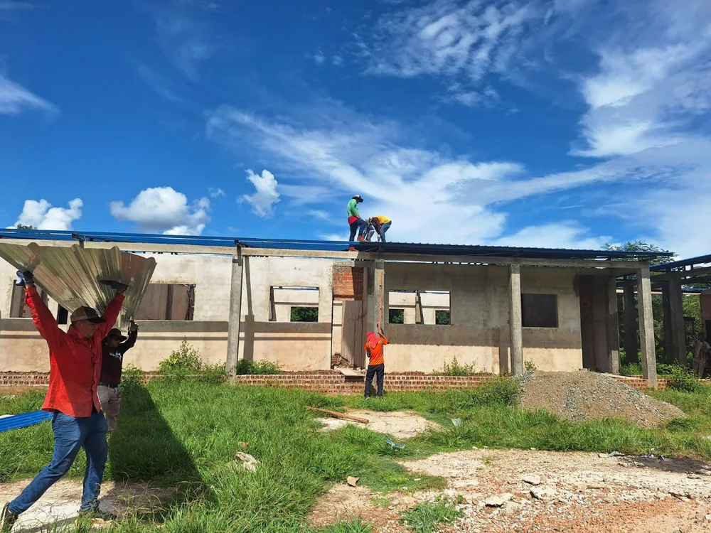 Roofing crew working on a residential roof in Central Texas