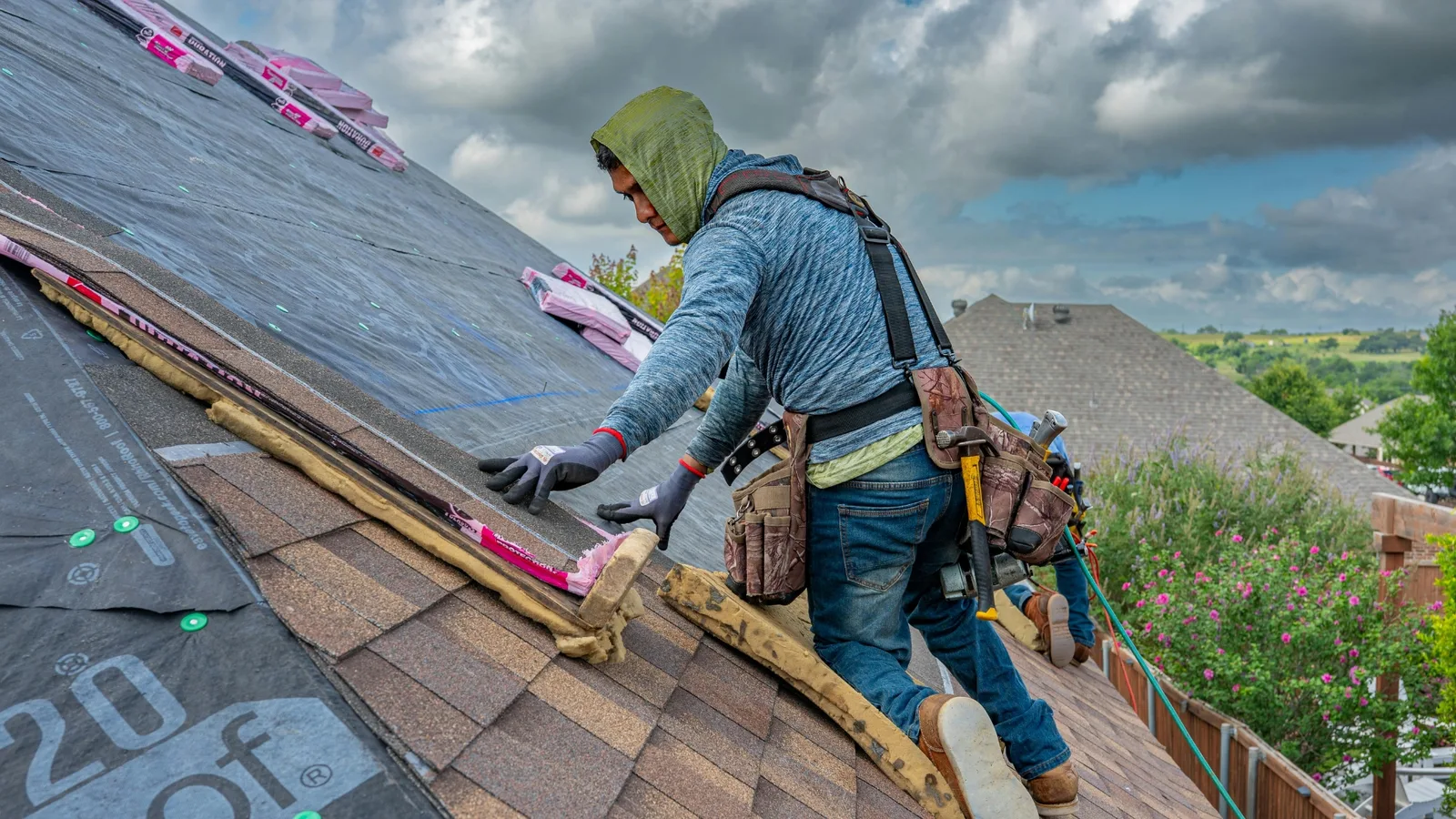Roofer installing asphalt shingles on a residential home in Killeen, Texas